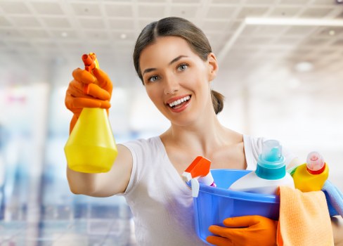 Domestic cleaner preparing a Colliers Wood home for a regular clean