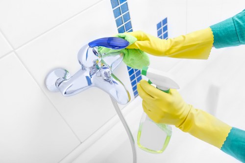 Carpet care professional noting service details after a complaint